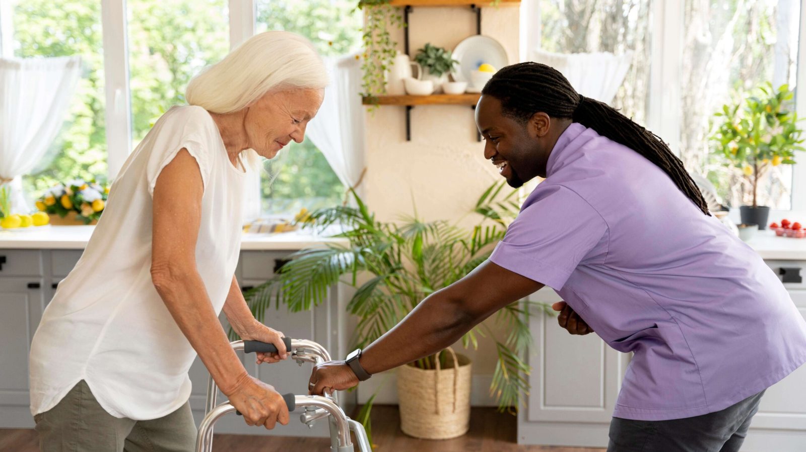 male_social_worker_taking_care_old_woman